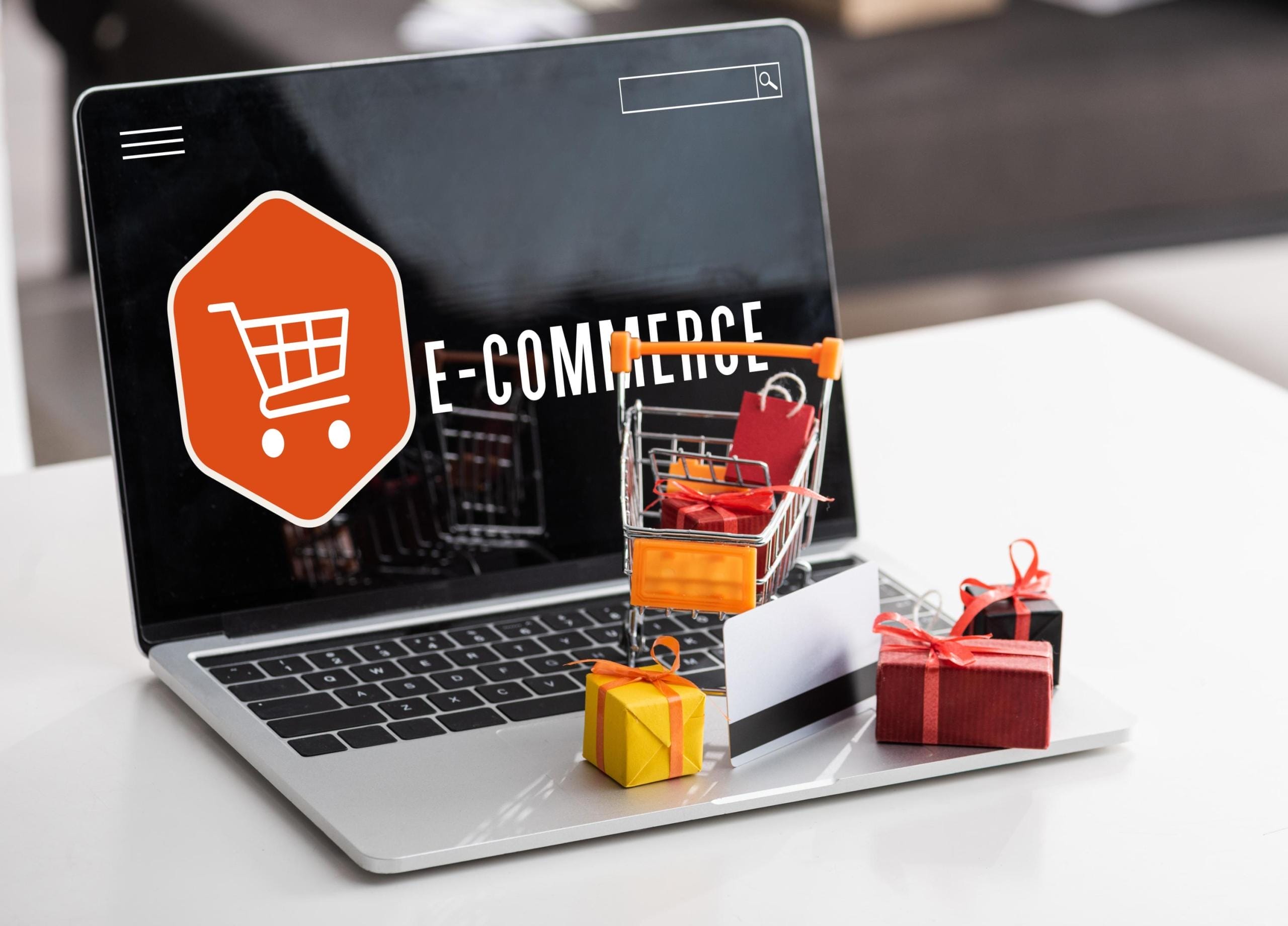 toy-gift-boxes-and-credit-card-on-laptop-with-e-commerce